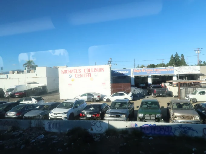 Michael Collision Center shop exterior at dusk